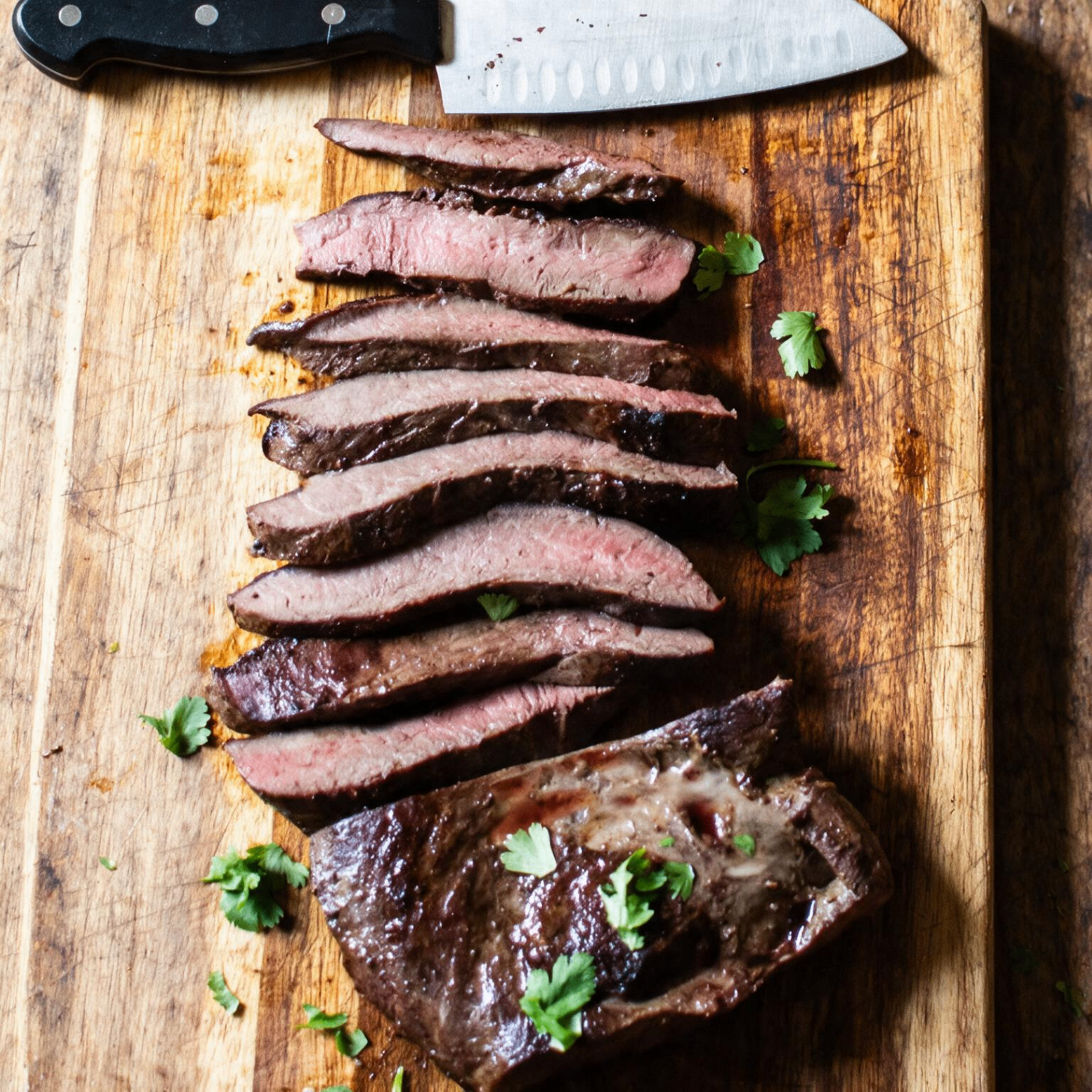 Grilled Black Angus beef heart skewers (anticuchos) with chimichurri