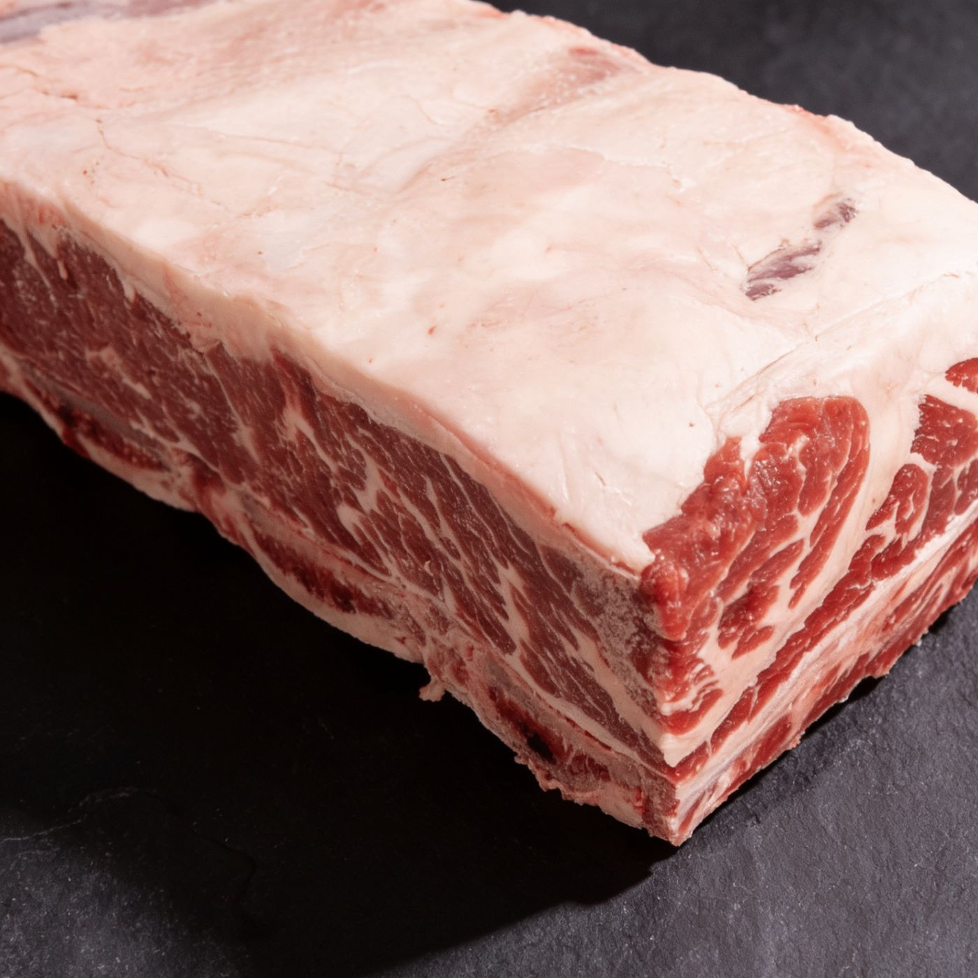Close-up of raw Black Angus bone-in beef short ribs
