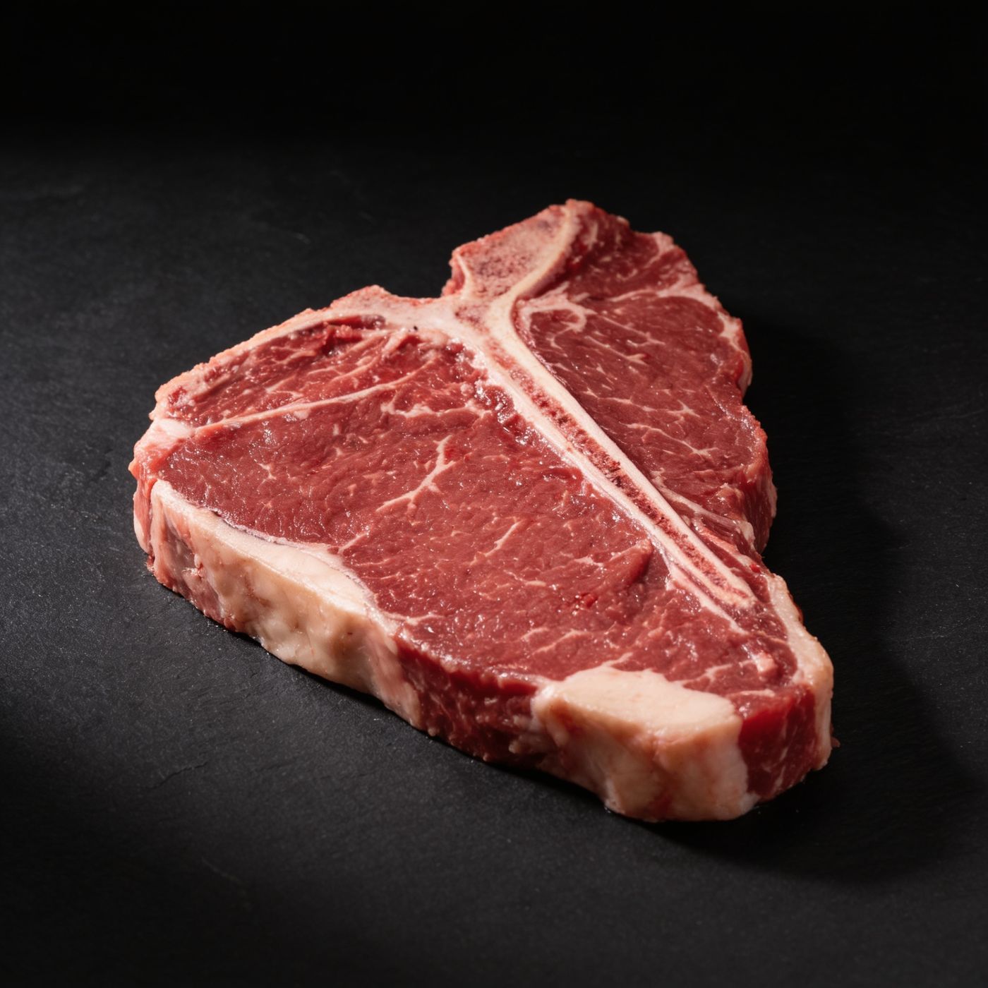Black Angus T-Bone halal UK supplier on dark slate